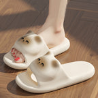 White cartoonish slippers on a wooden floor