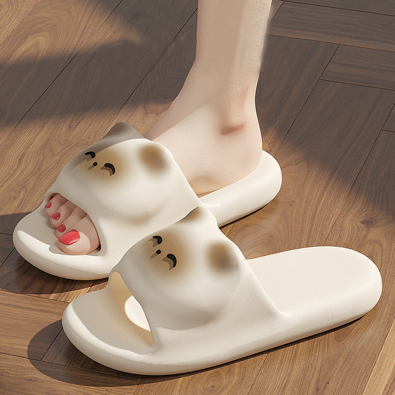 White cartoonish slippers on a wooden floor