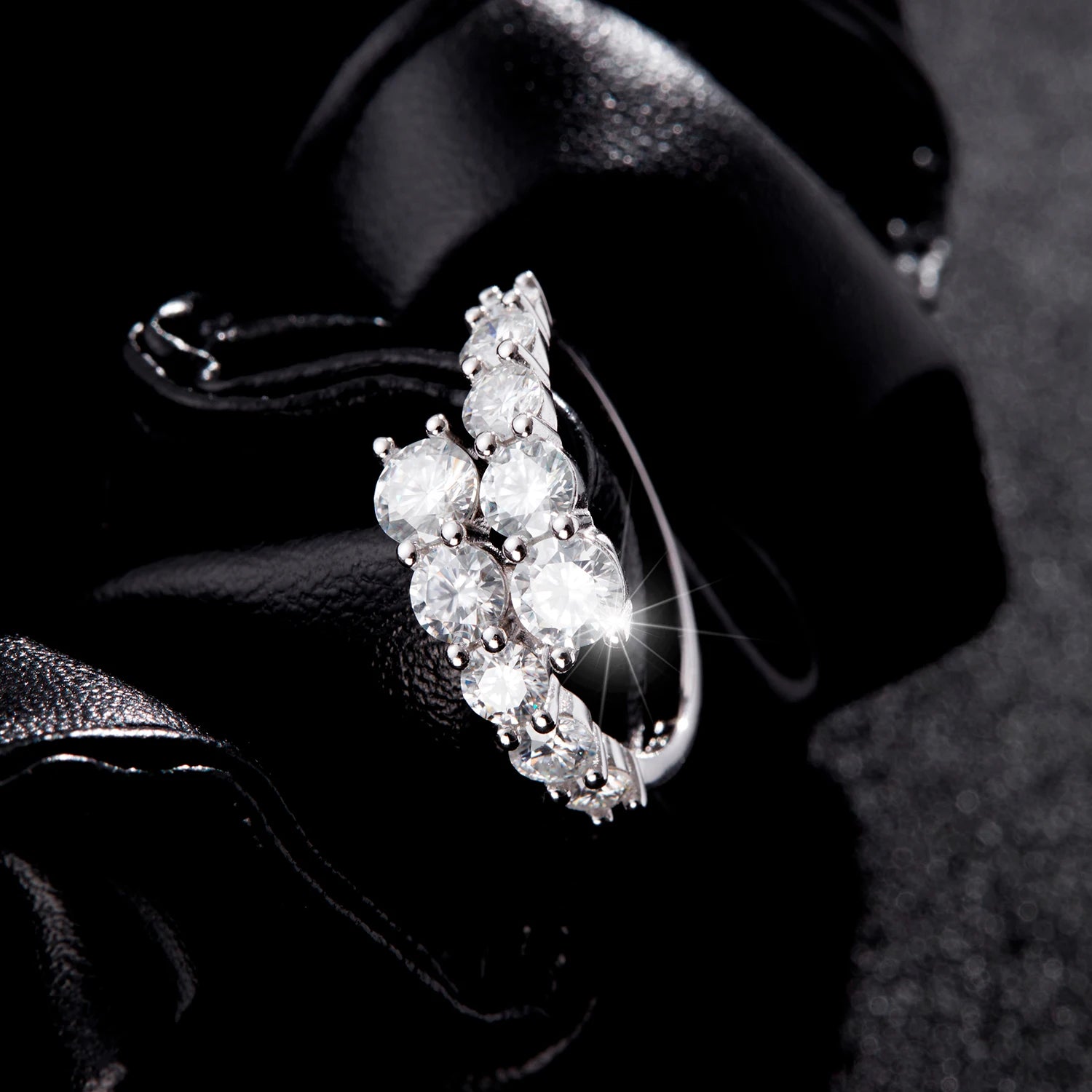 Sparkling diamond earring on a dark background